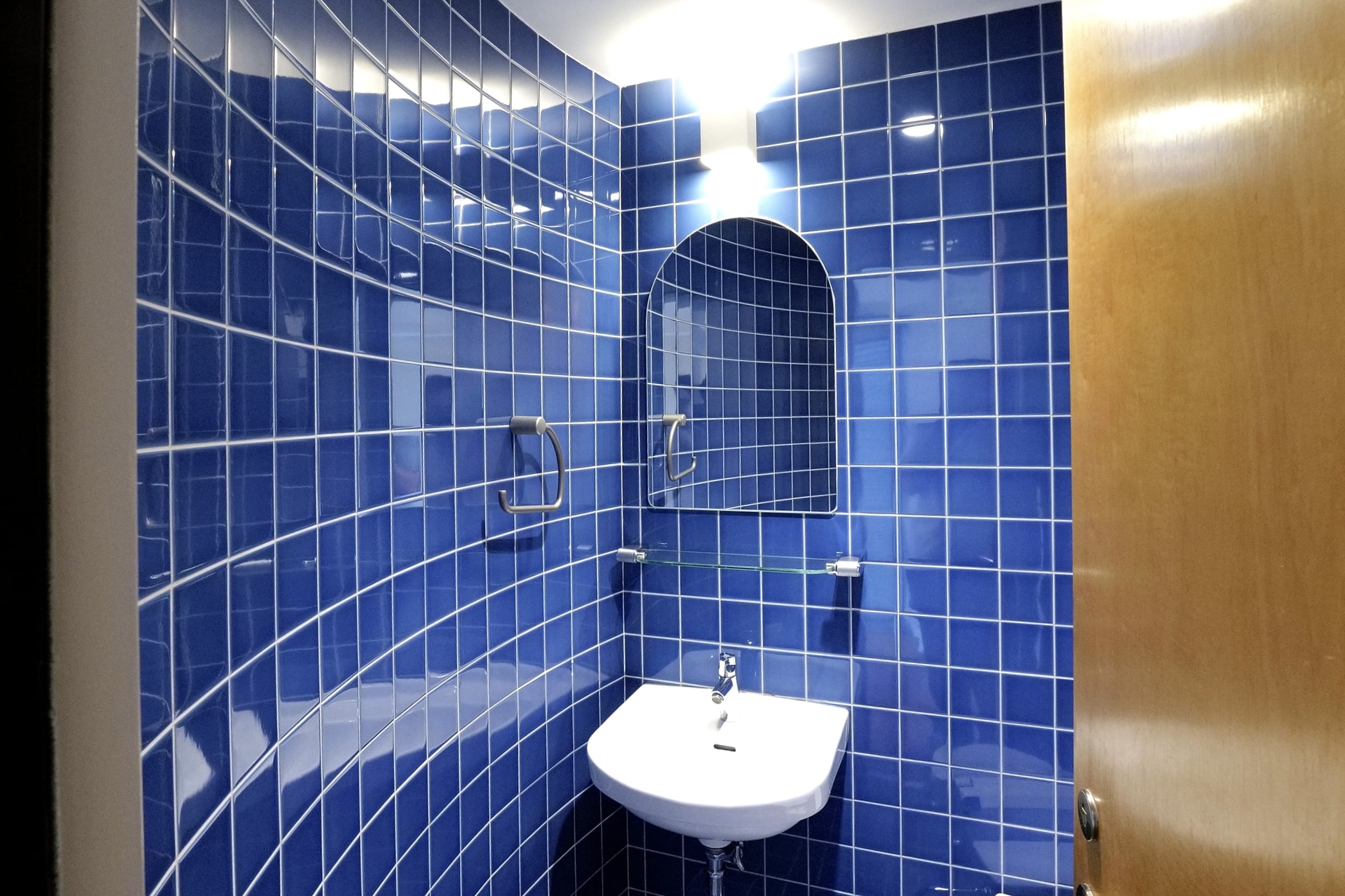 Blue-tiled second-floor restroom